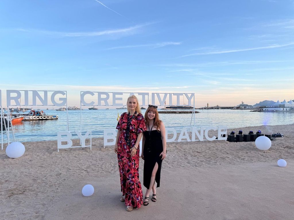 Kimberly and a colleague on the beach at Cannes